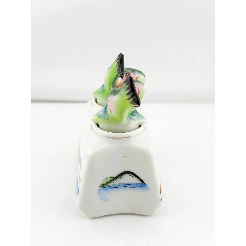 Vintage Japanese 1950's fish nodder salt & pepper shakers. Base shows fishing